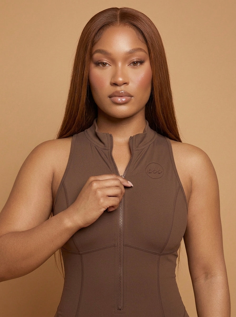 wrapd quarter-zip yoga romper in coffee brown, close-up of styling