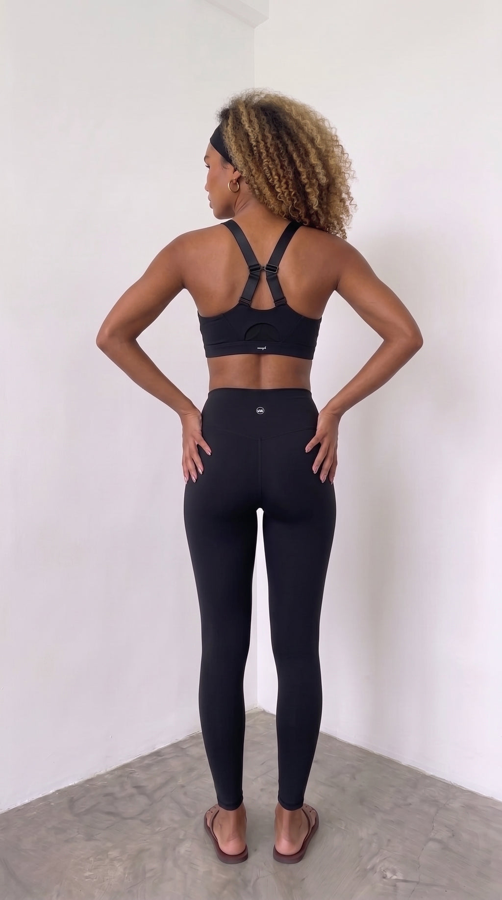 wrapd high-rise leggings in onyx, back view on model