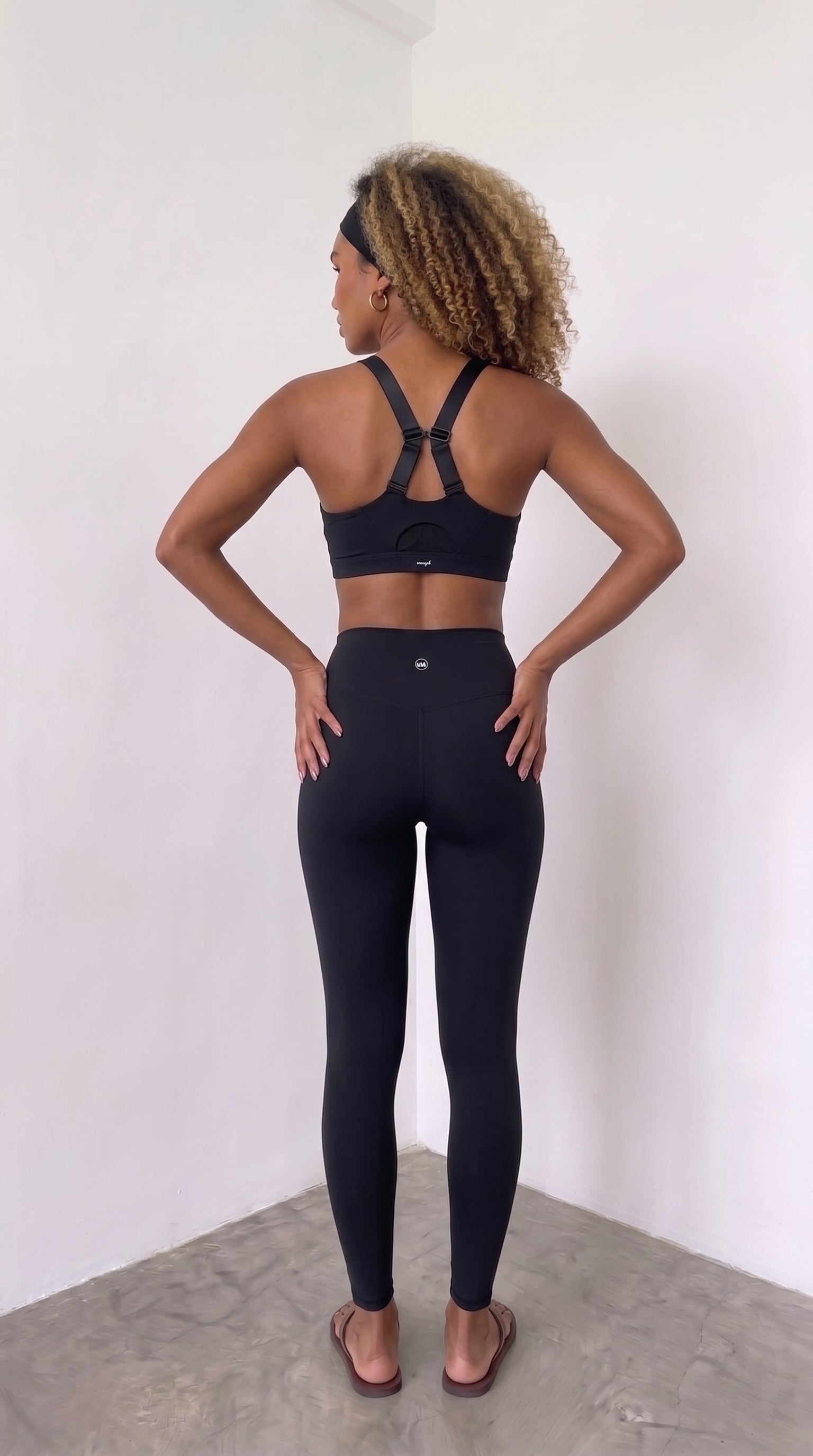 wrapd racerback sports bra in onyx, back view showing racerback strap detail