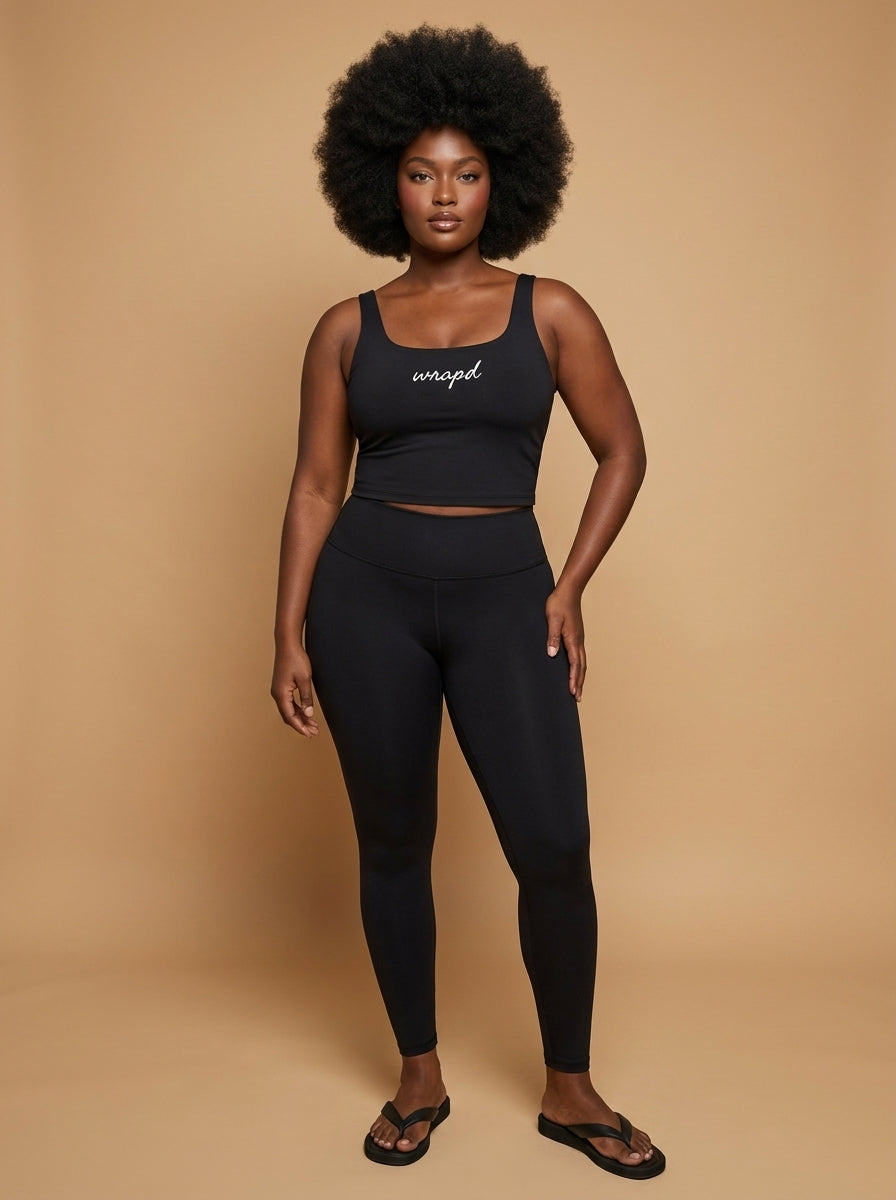 wrapd cropped tank in black, front view on model