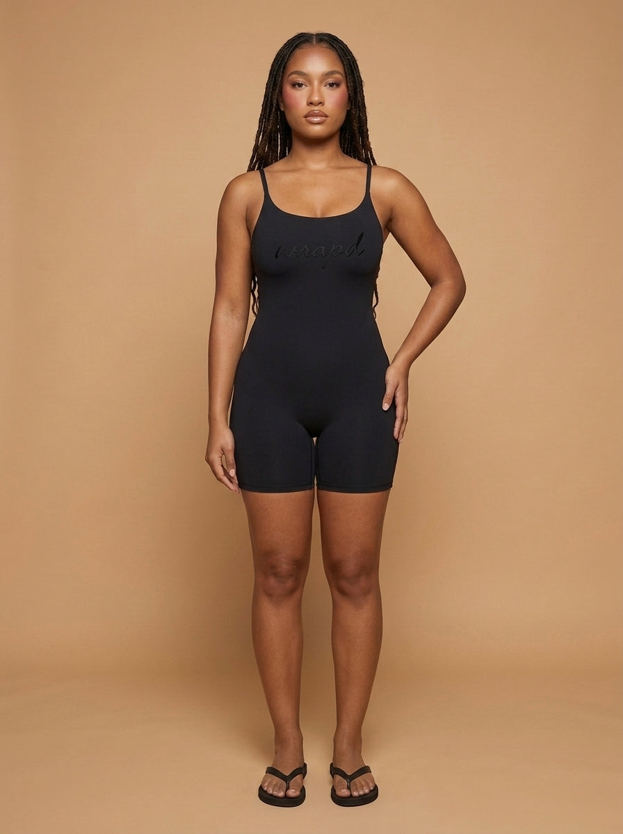wrapd u-neck yoga romper in black, close-up detail