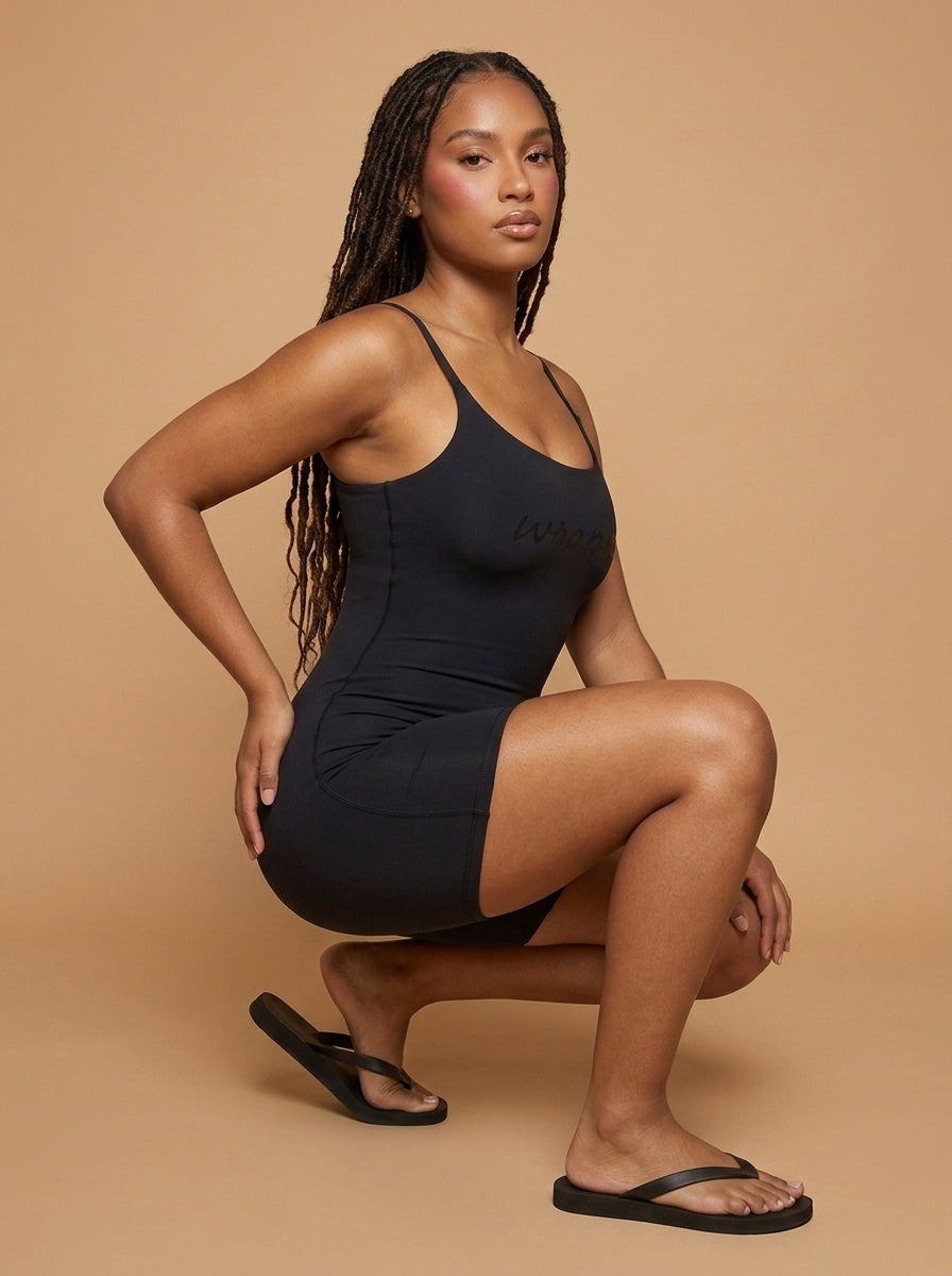 wrapd u-neck yoga romper in black, front view on model