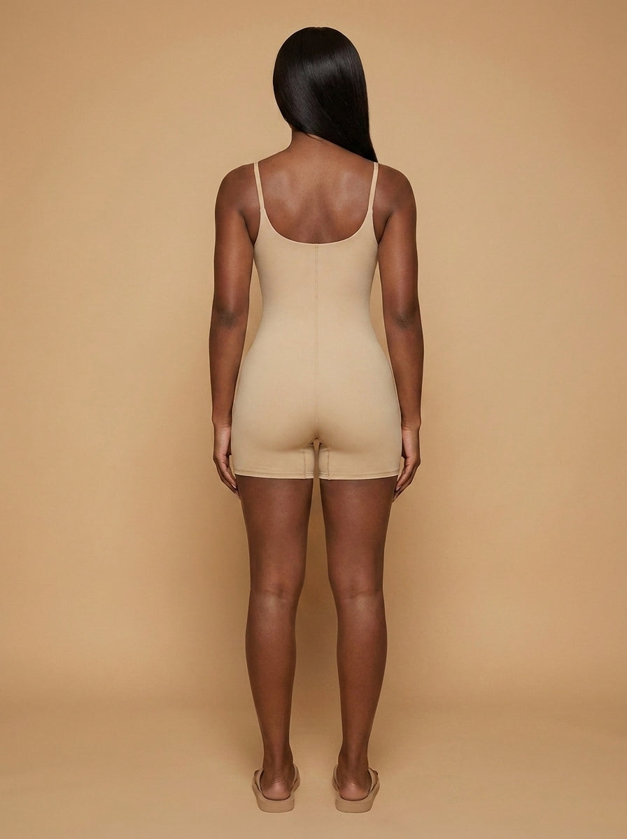 wrapd u-neck yoga romper in khaki, from behind on model